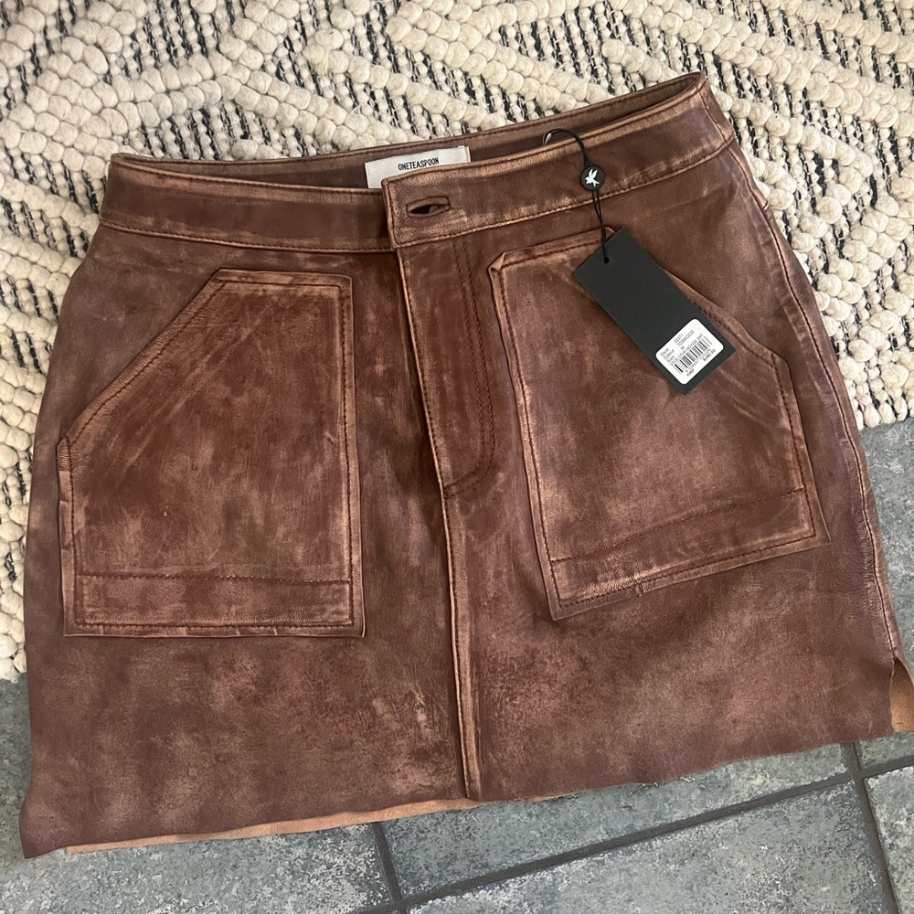 New with tag super great leather skirt! I’m small & it is a little big for me